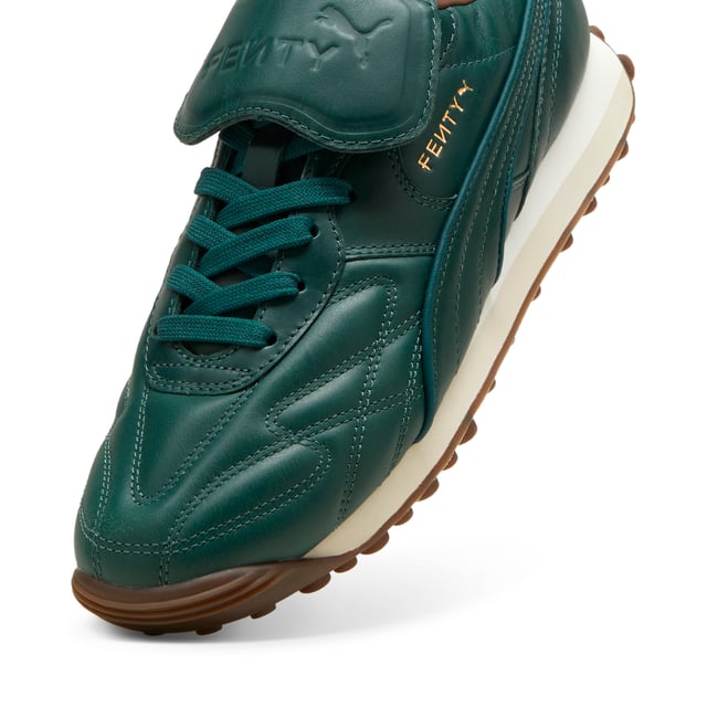PRODUCT STORY: The newest FENTY x PUMA Avanti by Rihanna is reinvented with premium leather, touches of gold, and retro gum soles. Inspired by football legends, this Avanti is worn by Romeo Beckham and many others in the latest FENTY x PUMA campaign. DETAILS: Oil-treated leather on upper, which wears over time; Lace closure; Foam wedge midsole; Dark gum outsole; FENTY x PUMA co-branding details.