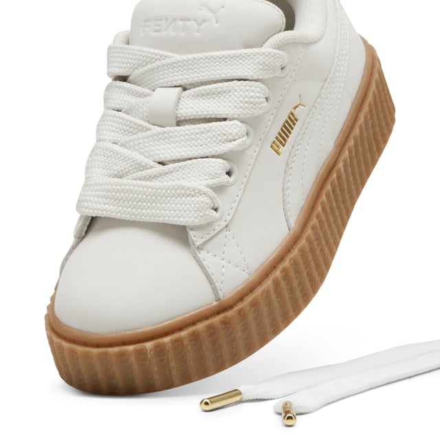 PRODUCT STORY: Rihanna and PUMA get down to earth with the Creeper Phatty Earth Tone. Made with luxe, high-quality nubuck, the new FENTY x PUMA Creeper Phatty stands out while blending in with soft, natural colors. Touches of gold and the classic Creeper sole elevate this new drop from Rihanna.DETAILS: Leather upper; Lace closure; Ribbed gum midsole; Gum outsole; PUMA Kids: Recommended for young kids between 4 and 8 years.