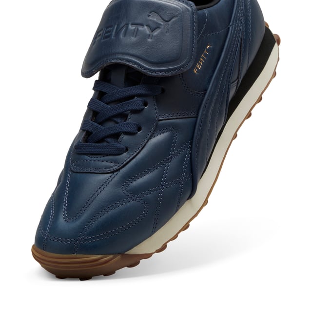 PRODUCT STORY: The newest FENTY x PUMA Avanti by Rihanna is reinvented with premium leather, touches of gold, and retro gum soles. Inspired by football legends, this Avanti is worn by Romeo Beckham and many others in the latest FENTY x PUMA campaign. DETAILS: Oil-treated leather on upper, which wears over time; Lace closure; Foam wedge midsole; Dark gum outsole; FENTY x PUMA co-branding details.