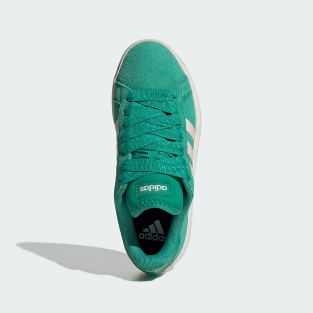Stylish yet practical, these adidas sneakers are your go-to. Whether wandering city streets or lounging in the park, the rich suede upper, emblazoned with the 3-Stripes, makes an instant impression. A classic rubber cupsole completes the look, adding sporty flair while providing traction on any terrain. Wear yours with everything from jeans to dresses. This product features at least 20% recycled materials. By reusing materials that have already been created, adidas help to reduce waste and our reliance on finite resources and reduce the footprint of the products adidas make.  - Regular fit - Lace closure - Suede upper - Textile lining - Rubber cupsole - Contains at least 20% recycled content  Shipped by adidas