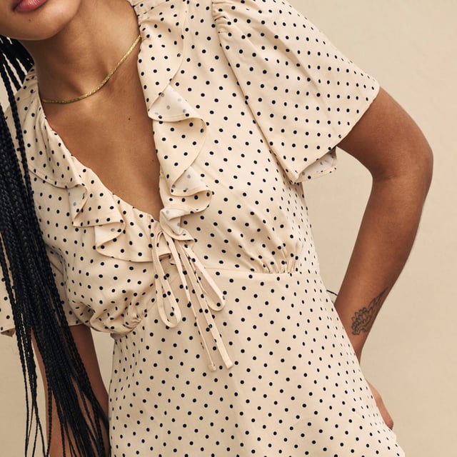 Women's Nobodys Child Joely Blouse. Every wardrobe needs a cute top like Joley. Woven entirely from responsible viscose, she’ll infuse a little vintage-inspired romance into your look with her fluted sleeves and floaty ruffles. We love the cream polka dot print and the figure-skimming fit. Style yours with black jeans.- V-neck.- Fluted sleeves.- Under bust seams designed to flatter.- String tie detail. Material: 100% Ecovero™ Viscose. Ref: T240662CRM.