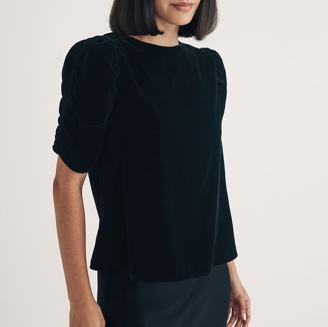 Women's Nobodys Child Velvet Gathered Sleeve Top. Your new favourite party top. Expertly crafted entirely from recycled materials, this classic black velvet number comes with pretty puff sleeves and a relaxed silhouette for comfort and style. Turn around to show off the statement bow and keyhole detailing at the back. Dress it down in the day with denim, or dazzle in a long slip skirt at night.- Crew neck.- Short puff sleeves.- Keyhole tie back fastening.- Designed for a relaxed fit. Material: 100% Polyester (Recycled). Ref: T241989BLK.