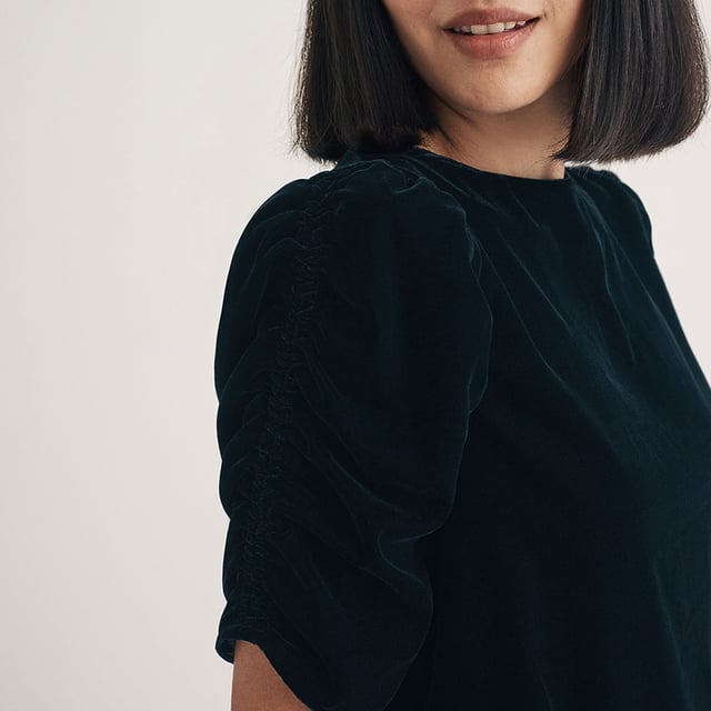 Women's Nobodys Child Velvet Gathered Sleeve Top. Your new favourite party top. Expertly crafted entirely from recycled materials, this classic black velvet number comes with pretty puff sleeves and a relaxed silhouette for comfort and style. Turn around to show off the statement bow and keyhole detailing at the back. Dress it down in the day with denim, or dazzle in a long slip skirt at night.- Crew neck.- Short puff sleeves.- Keyhole tie back fastening.- Designed for a relaxed fit. Material: 100% Polyester (Recycled). Ref: T241989BLK.