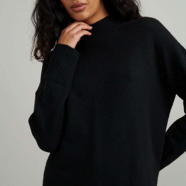 Women's Nobodys Child Longline Funnel Neck Sweater. Make a cosy update to your current jumper collection with this classic black layer. Your new go-to number features a funnel neck, long sleeves and ribbed cuffs. Style yours with denim.- Funnel neck.- Long sleeves.- Ribbed trims.- Designed for a relaxed cut.- We recommend folding your knits to avoid any unwanted stretching. Material: 62% Organic Cotton, 38% Polyester (Recycled). Ref: K241787BLK.
