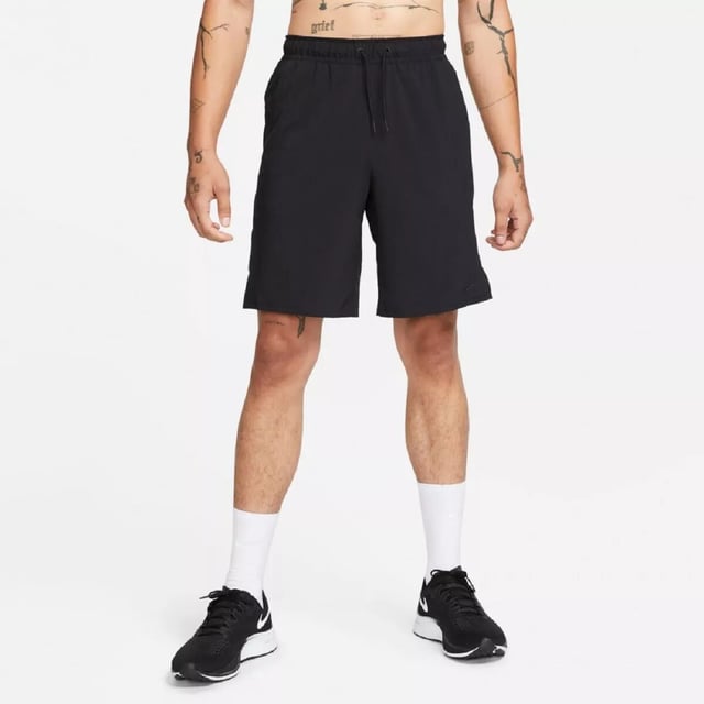 Nike Mens Dri Fit Unlimited Black Training Shorts The Nike Dri-FIT Unlimited Men’s 7-Inch Unlined Woven Fitness Shorts are a perfect upgrade to your workout wardrobe. Crafted from lightweight material, they feature an elastic waistband with an adjustable drawcord for a snug, secure fit. Equipped with Dri-FIT technology, these shorts wick away sweat to help you stay dry and focused during your training. Their solid color design is complemented by the iconic Nike Swoosh branding. They are machine washable—please follow the care label instructions for proper maintenance.