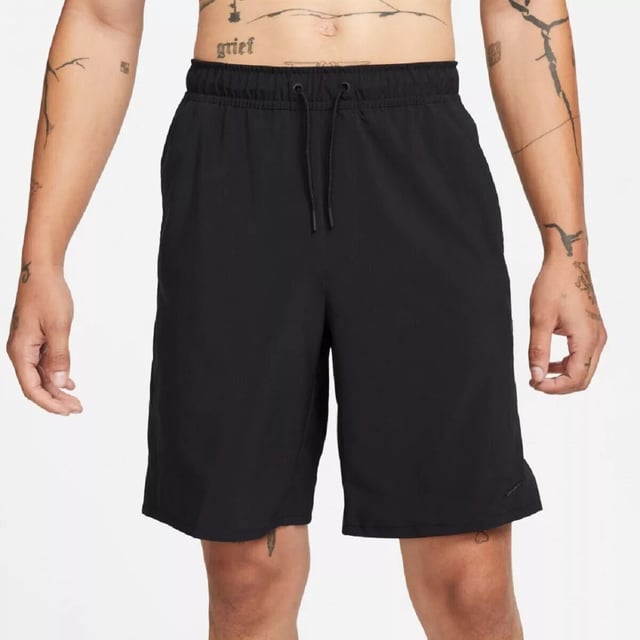 Nike Mens Dri Fit Unlimited Black Training Shorts The Nike Dri-FIT Unlimited Men’s 7-Inch Unlined Woven Fitness Shorts are a perfect upgrade to your workout wardrobe. Crafted from lightweight material, they feature an elastic waistband with an adjustable drawcord for a snug, secure fit. Equipped with Dri-FIT technology, these shorts wick away sweat to help you stay dry and focused during your training. Their solid color design is complemented by the iconic Nike Swoosh branding. They are machine washable—please follow the care label instructions for proper maintenance.