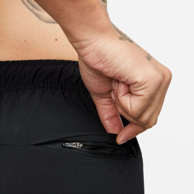 Nike Mens Dri Fit Unlimited Black Training Shorts The Nike Dri-FIT Unlimited Men’s 7-Inch Unlined Woven Fitness Shorts are a perfect upgrade to your workout wardrobe. Crafted from lightweight material, they feature an elastic waistband with an adjustable drawcord for a snug, secure fit. Equipped with Dri-FIT technology, these shorts wick away sweat to help you stay dry and focused during your training. Their solid color design is complemented by the iconic Nike Swoosh branding. They are machine washable—please follow the care label instructions for proper maintenance.