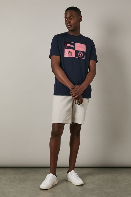 Crafted from soft cotton jersey for all-day comfort
        Features a distinctive sailing crest graphic print in contrasting hues
        Classic crew neck design with short sleeves for a timeless silhouette
        Straight hem with clean finishing for a polished appearance
        Part of the Maine collection, reflecting nautical heritage and style
    
    This Maine Sailing Crest Print T-shirt combines casual comfort with maritime charm. The striking quadrant design showcases nautical motifs including a sailing boat and crest emblem, perfect for adding character to your weekend wardrobe. Style as seen on our model with light-coloured shorts and crisp white trainers for an effortless summer look that works brilliantly for coastal walks or casual gatherings. For cooler evenings, layer under a lightweight bomber jacket or unstructured blazer. The versatile design transitions seamlessly from daytime outings to relaxed evening socials, making it an essential addition to your casual collection. Machine washable at 30 degrees, this t-shirt maintains its shape and graphic detail with proper care.