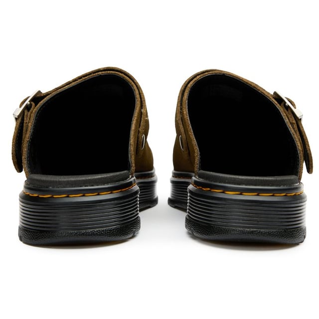 The Dr Martens Brookline slides bring rebellious attitude to warm-weather styling. These green leather sandals maintain the brand's iconic DNA with their signature buckle detailing and classic Goodyear-welted construction. The air-cushioned rubber sole delivers that familiar bouncy comfort, while the synthetic lining ensures durability. Perfect for those who refuse to compromise on style or comfort when temperatures rise â these versatile slides effortlessly blend Dr Martens' rugged heritage with practical summer design.
