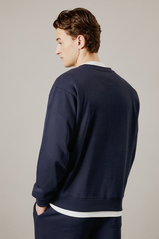 Classic crew neck design with ribbed collar for a comfortable fit
        Soft jersey fabric provides warmth without bulk
        Ribbed cuffs and hem maintain shape throughout wear
        Relaxed silhouette offers ease of movement for everyday activities
        Versatile layering piece that works across seasons
    
    This Burton crew neck sweatshirt delivers timeless casual style with practical comfort. The clean, unfussy design makes it a wardrobe essential that pairs effortlessly with your existing collection. Layer it over a simple white t-shirt as shown for a classic look, or wear it solo when temperatures rise. Perfect for weekend sports matches, casual pub gatherings with mates, or relaxed family occasions. The straightforward styling works brilliantly with matching joggers for a coordinated athleisure look, or team with your favourite jeans and trainers for everyday wear. For cooler days, it slides easily under a gilet or jacket without adding unnecessary bulk. Machine washable and durable, this sweatshirt offers the reliable performance you need from your casual wardrobe staples.
