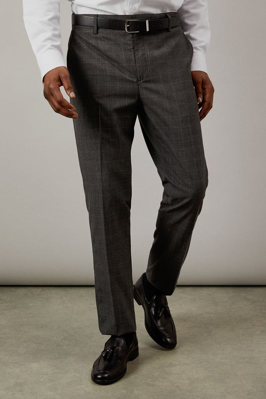 Classic Prince of Wales check pattern adds sophisticated visual interest
        Slim fit design offers a modern, streamlined silhouette
        Clean front styling with side pockets for practicality
        Back pockets with button closure for secure storage
        Versatile charcoal tone perfect for year-round wear
    
    These Burton slim fit trousers showcase timeless British tailoring with a contemporary edge. The distinctive Prince of Wales check pattern presents a refined aesthetic that works brilliantly for smart occasions whilst maintaining versatility. Style them as seen with a crisp white shirt and polished black leather shoes for business meetings or important presentations. For smart-casual events, pair with a fine merino wool jumper and Chelsea boots. The slim cut through the seat and thigh creates a sharp silhouette without sacrificing comfort, making these trousers ideal for long days at the office or evening gatherings at upmarket venues. Perfect for the man who appreciates classic style with modern proportions, these trousers will become a cornerstone of your smart wardrobe, transitioning effortlessly from boardroom to bar.