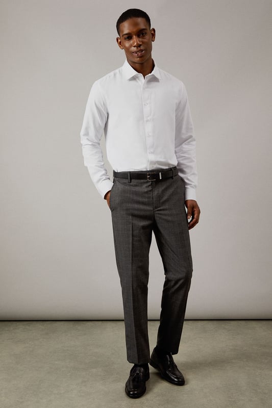 Classic Prince of Wales check pattern adds sophisticated visual interest
        Slim fit design offers a modern, streamlined silhouette
        Clean front styling with side pockets for practicality
        Back pockets with button closure for secure storage
        Versatile charcoal tone perfect for year-round wear
    
    These Burton slim fit trousers showcase timeless British tailoring with a contemporary edge. The distinctive Prince of Wales check pattern presents a refined aesthetic that works brilliantly for smart occasions whilst maintaining versatility. Style them as seen with a crisp white shirt and polished black leather shoes for business meetings or important presentations. For smart-casual events, pair with a fine merino wool jumper and Chelsea boots. The slim cut through the seat and thigh creates a sharp silhouette without sacrificing comfort, making these trousers ideal for long days at the office or evening gatherings at upmarket venues. Perfect for the man who appreciates classic style with modern proportions, these trousers will become a cornerstone of your smart wardrobe, transitioning effortlessly from boardroom to bar.