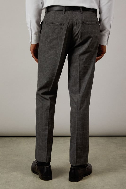Classic Prince of Wales check pattern adds sophisticated visual interest
        Slim fit design offers a modern, streamlined silhouette
        Clean front styling with side pockets for practicality
        Back pockets with button closure for secure storage
        Versatile charcoal tone perfect for year-round wear
    
    These Burton slim fit trousers showcase timeless British tailoring with a contemporary edge. The distinctive Prince of Wales check pattern presents a refined aesthetic that works brilliantly for smart occasions whilst maintaining versatility. Style them as seen with a crisp white shirt and polished black leather shoes for business meetings or important presentations. For smart-casual events, pair with a fine merino wool jumper and Chelsea boots. The slim cut through the seat and thigh creates a sharp silhouette without sacrificing comfort, making these trousers ideal for long days at the office or evening gatherings at upmarket venues. Perfect for the man who appreciates classic style with modern proportions, these trousers will become a cornerstone of your smart wardrobe, transitioning effortlessly from boardroom to bar.