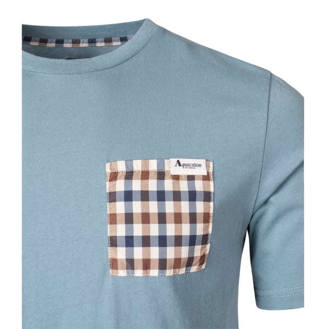 Aquascutum ACTIVE CHECK POCKET T-SHIRT elevates casual style with sophisticated British heritage design. This striking blue men's tee features the brand's signature check pattern on the pocket, creating a distinctive accent that sets you apart from the crowd. Crafted from premium 100% cotton for exceptional comfort and breathability, it's perfect for all-day wear. The understated small logo adds a touch of luxury without overwhelming the clean aesthetic. Part of the FW23 collection, this versatile T-shirt transitions effortlessly from casual daytime outings to relaxed evening gatherings. Pair with jeans for an effortless look or layer under a blazer for smart-casual sophistication