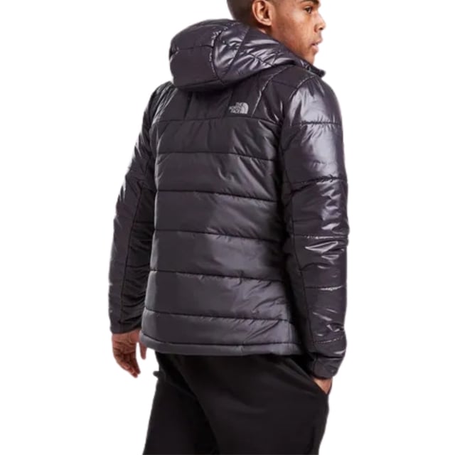 Glossy accents on sleeves and shoulders elevate this North Face men's black jacket, creating a striking contrast that demands attention. Perfect for those who want to make a statement while staying warm. 100% Polyester