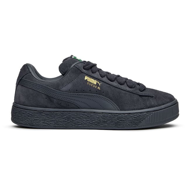 Zapatillas Puma Suede XL para hombre, grises, fabricadas en ante y con suela de goma. Presentan: diseño XL, lengüeta acolchada, cordones gruesos y cordones de repuesto.