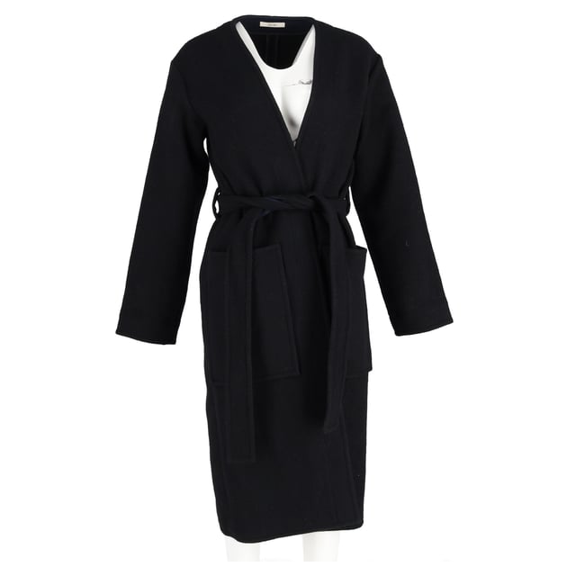 VINTAGE, RRP AS NEW
Quiet luxury, redefined.
Wrap yourself in the ultimate expression of elegance with the Celine Belted Coat in Black Cashmere. Designed in a fluid, minimalist silhouette, this coat exudes understated sophistication with its buttery-soft cashmere, tailored shoulders, and a self-tie belt that cinches the waist for a graceful, feminine shape. The deep black hue offers timeless versatility, making it the ideal outer layer for everything from silk dresses to structured workwear. It’s not just a coat—it’s a wardrobe investment in everyday refinement.

Celine Belted Coat in Black Cashmere
Condition: Excellent
Signs of wear: No retail tag but Brand tag on., No visible sign of wear., 
Packaging: None
Color: Black 
Material: Cashmere
Size: EU | 38
Measurements: Length: 1150; Chest: 550
SKU: NAPPUGBCL473819W