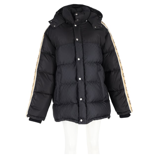 VINTAGE, RRP AS NEW
Make a bold winter statement with the Gucci Logo-Jacquard Webbing-Trimmed Quilted Shell Hooded Down Jacket in Black Nylon. This stylish jacket features Gucci’s iconic interlocking 'GG' insignia, making it an unmistakable fashion-forward choice for colder months. Crafted from a blend of solid and monogrammed black shell, the jacket showcases logo-jacquard taping down the sleeves for a modern, branded touch. The quilted design evenly disperses the down filling, ensuring optimal warmth and comfort while maintaining a sleek silhouette. Whether you're navigating the city streets or enjoying après-ski, this jacket adds a touch of luxury and sophistication to your winter wardrobe, pairing effortlessly with both casual and elevated looks.


Gucci Logo-Jacquard Webbing-Trimmed Quilted Shell Hooded Down Jacket in Black Nylon
Condition: Excellent
Signs of wear: No retail tag but Brand tag on., No visible sign of wear., 
Packaging: None
Color: black
Material: Nylon
Size: INT | XL/IT46
Measurements: Length: 750; Chest: 650
SKU: NAPPUGBCL461250W