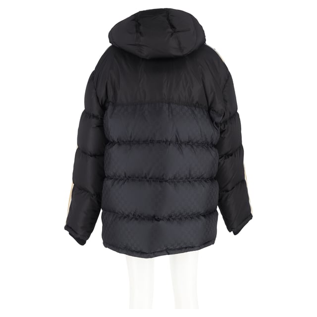 VINTAGE, RRP AS NEW
Make a bold winter statement with the Gucci Logo-Jacquard Webbing-Trimmed Quilted Shell Hooded Down Jacket in Black Nylon. This stylish jacket features Gucci’s iconic interlocking 'GG' insignia, making it an unmistakable fashion-forward choice for colder months. Crafted from a blend of solid and monogrammed black shell, the jacket showcases logo-jacquard taping down the sleeves for a modern, branded touch. The quilted design evenly disperses the down filling, ensuring optimal warmth and comfort while maintaining a sleek silhouette. Whether you're navigating the city streets or enjoying après-ski, this jacket adds a touch of luxury and sophistication to your winter wardrobe, pairing effortlessly with both casual and elevated looks.


Gucci Logo-Jacquard Webbing-Trimmed Quilted Shell Hooded Down Jacket in Black Nylon
Condition: Excellent
Signs of wear: No retail tag but Brand tag on., No visible sign of wear., 
Packaging: None
Color: black
Material: Nylon
Size: INT | XL/IT46
Measurements: Length: 750; Chest: 650
SKU: NAPPUGBCL461250W