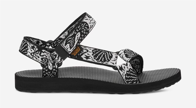 Teva Original Universal Women's Black/White Sandals Eco-friendly adventure sandals featuring the Universal Strapping System™ with multiple adjustable points for a secure fit. Crafted with quick dry webbing made from recycled REPREVE® polyester. Treated with Life Natural, a plant-based peppermint anti odour solution. Durable rubber outsole provides reliable grip for outdoor activities.