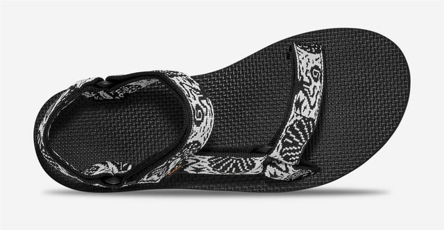 Teva Original Universal Women's Black/White Sandals Eco-friendly adventure sandals featuring the Universal Strapping System™ with multiple adjustable points for a secure fit. Crafted with quick dry webbing made from recycled REPREVE® polyester. Treated with Life Natural, a plant-based peppermint anti odour solution. Durable rubber outsole provides reliable grip for outdoor activities.