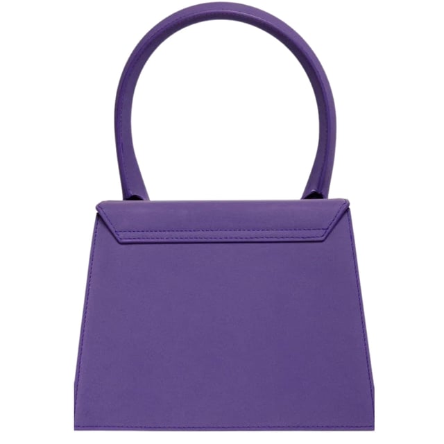 Elevate your accessory collection with the exquisite Jacquemus Le Grand Chiquito Purple Bag. This stunning designer piece combines luxurious craftsmanship with the perfect pop of vibrant purple, creating an unforgettable statement accessory. The compact yet practical size offers versatility for both day and evening wear, while the distinctive Jacquemus styling ensures you'll stand out from the crowd. A must-have investment piece that effortlessly transitions between seasons and complements any fashion-forward wardrobe. Dimensions: 18x13x7.5 cm. 100% Leather Made In Italy