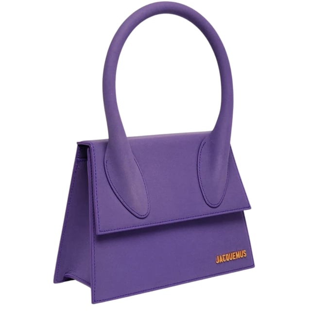 Elevate your accessory collection with the exquisite Jacquemus Le Grand Chiquito Purple Bag. This stunning designer piece combines luxurious craftsmanship with the perfect pop of vibrant purple, creating an unforgettable statement accessory. The compact yet practical size offers versatility for both day and evening wear, while the distinctive Jacquemus styling ensures you'll stand out from the crowd. A must-have investment piece that effortlessly transitions between seasons and complements any fashion-forward wardrobe. Dimensions: 18x13x7.5 cm. 100% Leather Made In Italy