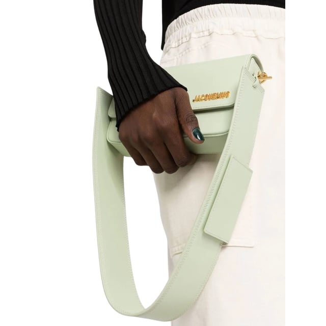 Jacquemus Le Carinu Light Green Bag is the statement accessory your wardrobe craves. This exquisite designer piece combines fashion-forward aesthetics with practical elegance, featuring the distinctive Jacquemus silhouette that fashion enthusiasts adore. The refreshing light green hue adds a vibrant pop of color to any outfit, making it perfect for both casual daytime looks and evening ensembles. Crafted with premium materials and meticulous attention to detail, this women's bag isn't just an accessory-it's an investment in timeless style that elevates your fashion credentials instantly. Dimensions: 12 x 18.5cm 100% Leather Made In Spain