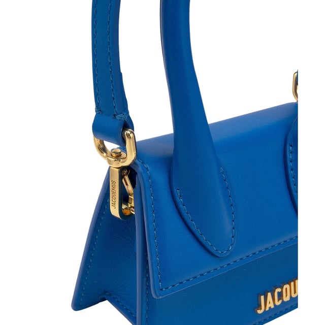 Elevate your style with the iconic Jacquemus Le Chiquito Blue Bag, a statement accessory that combines luxury with contemporary design. This coveted mini bag in stunning blue adds a pop of color to any outfit while showcasing your fashion-forward sensibilities. Perfect for day-to-night transitions, its compact size holds your essentials without compromising on style. Join the fashion elite who have made this must-have piece their signature accessory. The ultimate investment in timeless French design. Dimensions: 18x13x7.5 cm. 100% Leather Made In Italy