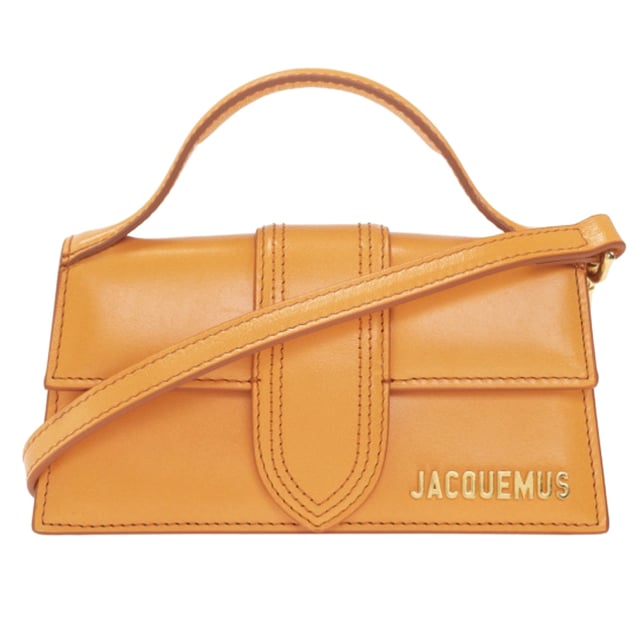 Elevate your style with the Jacquemus Le Bambino Orange Bag, a statement accessory that commands attention. This vibrant orange masterpiece from the coveted Jacquemus collection combines compact design with maximum impact. Perfect for day-to-night transitions, its distinctive silhouette and premium craftsmanship ensure you'll stand out from the crowd. Don't just carry a bag-make a fashion declaration that speaks volumes about your impeccable taste. Dimensions: 17.5 x 9.5 x 5.5 cm. 100% Leather Made In Italy