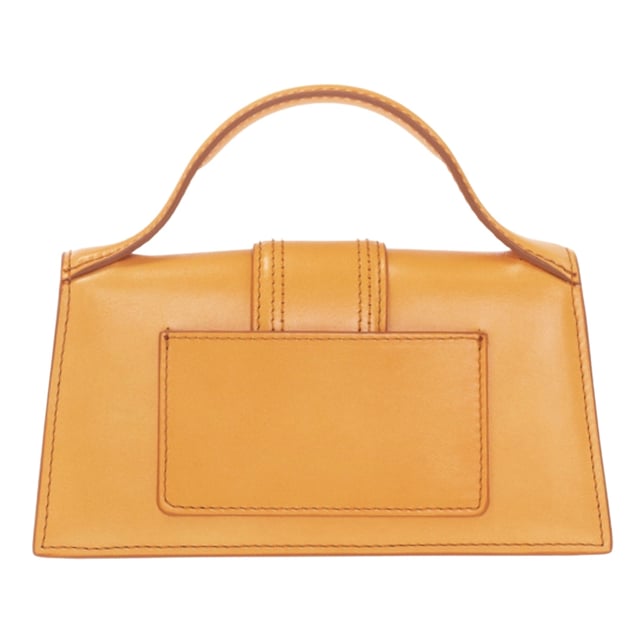 Elevate your style with the Jacquemus Le Bambino Orange Bag, a statement accessory that commands attention. This vibrant orange masterpiece from the coveted Jacquemus collection combines compact design with maximum impact. Perfect for day-to-night transitions, its distinctive silhouette and premium craftsmanship ensure you'll stand out from the crowd. Don't just carry a bag-make a fashion declaration that speaks volumes about your impeccable taste. Dimensions: 17.5 x 9.5 x 5.5 cm. 100% Leather Made In Italy