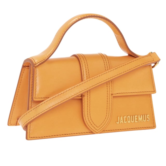 Elevate your style with the Jacquemus Le Bambino Orange Bag, a statement accessory that commands attention. This vibrant orange masterpiece from the coveted Jacquemus collection combines compact design with maximum impact. Perfect for day-to-night transitions, its distinctive silhouette and premium craftsmanship ensure you'll stand out from the crowd. Don't just carry a bag-make a fashion declaration that speaks volumes about your impeccable taste. Dimensions: 17.5 x 9.5 x 5.5 cm. 100% Leather Made In Italy