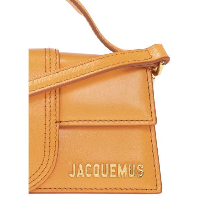 Elevate your style with the Jacquemus Le Bambino Orange Bag, a statement accessory that commands attention. This vibrant orange masterpiece from the coveted Jacquemus collection combines compact design with maximum impact. Perfect for day-to-night transitions, its distinctive silhouette and premium craftsmanship ensure you'll stand out from the crowd. Don't just carry a bag-make a fashion declaration that speaks volumes about your impeccable taste. Dimensions: 17.5 x 9.5 x 5.5 cm. 100% Leather Made In Italy