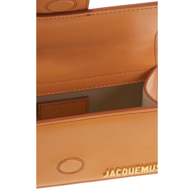 Elevate your style with the Jacquemus Le Bambino Orange Bag, a statement accessory that commands attention. This vibrant orange masterpiece from the coveted Jacquemus collection combines compact design with maximum impact. Perfect for day-to-night transitions, its distinctive silhouette and premium craftsmanship ensure you'll stand out from the crowd. Don't just carry a bag-make a fashion declaration that speaks volumes about your impeccable taste. Dimensions: 17.5 x 9.5 x 5.5 cm. 100% Leather Made In Italy