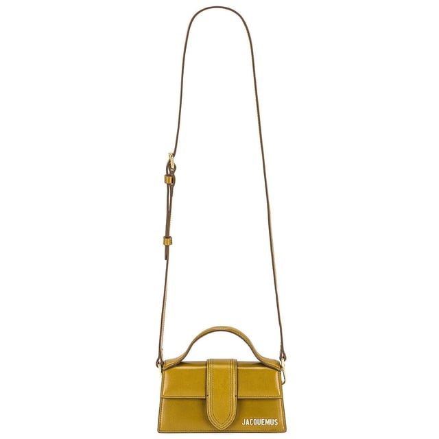 Elevate your accessory collection with the Jacquemus Le Bambino Light Khaki Green Bag. This exquisite designer piece combines understated elegance with contemporary style, featuring the signature Jacquemus minimalist aesthetic in a versatile khaki green shade. Perfect for day-to-night transitions, this compact yet statement-making bag offers both fashion-forward appeal and practical functionality. A must-have addition for the modern woman who appreciates luxury craftsmanship and distinctive design. 17.5 x 9.5 x 5.5 cm. 100% Leather Made In Italy