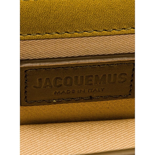 Elevate your accessory collection with the Jacquemus Le Bambino Light Khaki Green Bag. This exquisite designer piece combines understated elegance with contemporary style, featuring the signature Jacquemus minimalist aesthetic in a versatile khaki green shade. Perfect for day-to-night transitions, this compact yet statement-making bag offers both fashion-forward appeal and practical functionality. A must-have addition for the modern woman who appreciates luxury craftsmanship and distinctive design. 17.5 x 9.5 x 5.5 cm. 100% Leather Made In Italy