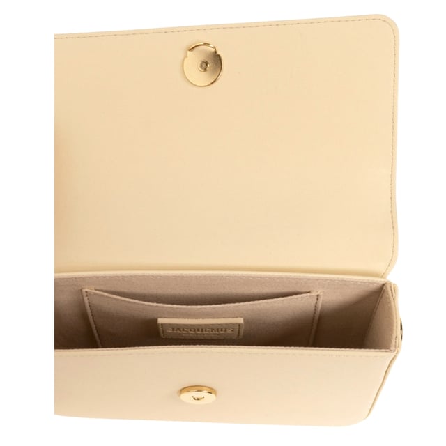 Elevate your accessory collection with the exquisite Jacquemus Le Carinu Ivory White Bag. This stunning designer piece combines timeless elegance with contemporary flair, making it the perfect statement accessory for any outfit. Crafted with meticulous attention to detail, this ivory white treasure embodies luxury and sophistication. The versatile design transitions effortlessly from day to evening, ensuring you'll stand out with refined style wherever you go. A must-have addition to any fashion-forward woman's wardrobe. Dimensions 12 x 18.5cm. 100% Leather Made In Spain