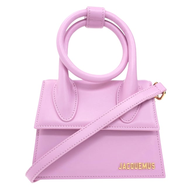 Elevate your accessory collection with the exquisite Jacquemus Le Chiquito Noeud Light Pink Bag. This coveted designer piece combines Parisian elegance with contemporary style, featuring the iconic miniature silhouette that has captivated fashion enthusiasts worldwide. The delicate light pink hue adds a touch of feminine charm to any outfit, while the distinctive knotted detail makes a sophisticated statement. Perfect for special occasions or adding luxury to everyday ensembles, this must-have bag proves that the most extraordinary style comes in small packages. Dimensions: 18x13x7.5 cm. 100% Leather Made In Spain