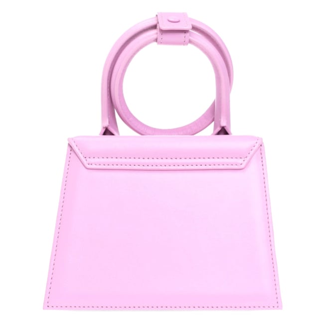 Elevate your accessory collection with the exquisite Jacquemus Le Chiquito Noeud Light Pink Bag. This coveted designer piece combines Parisian elegance with contemporary style, featuring the iconic miniature silhouette that has captivated fashion enthusiasts worldwide. The delicate light pink hue adds a touch of feminine charm to any outfit, while the distinctive knotted detail makes a sophisticated statement. Perfect for special occasions or adding luxury to everyday ensembles, this must-have bag proves that the most extraordinary style comes in small packages. Dimensions: 18x13x7.5 cm. 100% Leather Made In Spain