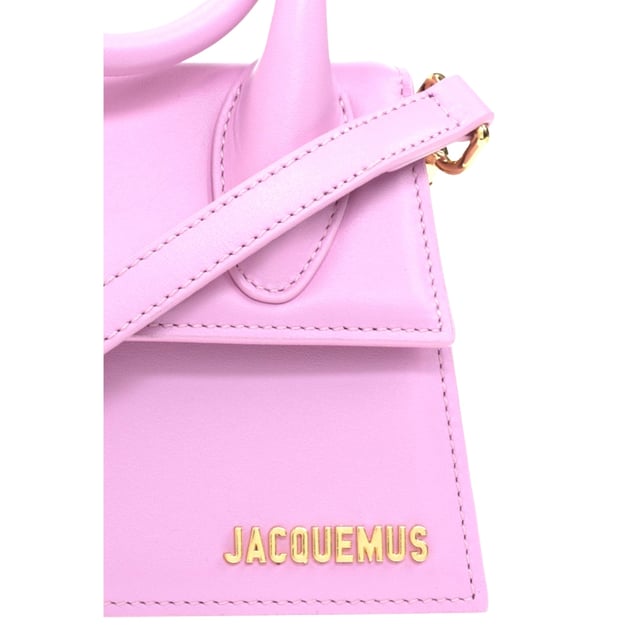 Elevate your accessory collection with the exquisite Jacquemus Le Chiquito Noeud Light Pink Bag. This coveted designer piece combines Parisian elegance with contemporary style, featuring the iconic miniature silhouette that has captivated fashion enthusiasts worldwide. The delicate light pink hue adds a touch of feminine charm to any outfit, while the distinctive knotted detail makes a sophisticated statement. Perfect for special occasions or adding luxury to everyday ensembles, this must-have bag proves that the most extraordinary style comes in small packages. Dimensions: 18x13x7.5 cm. 100% Leather Made In Spain