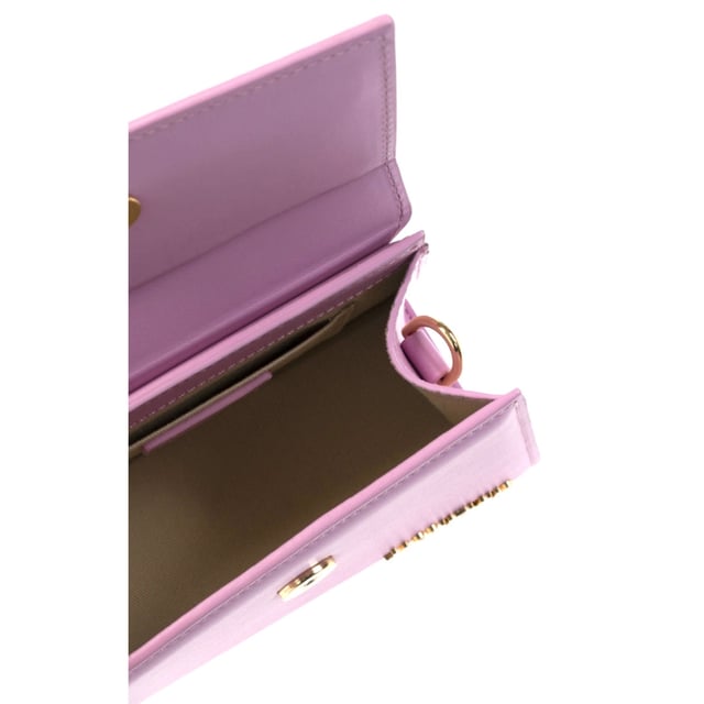 Elevate your accessory collection with the exquisite Jacquemus Le Chiquito Noeud Light Pink Bag. This coveted designer piece combines Parisian elegance with contemporary style, featuring the iconic miniature silhouette that has captivated fashion enthusiasts worldwide. The delicate light pink hue adds a touch of feminine charm to any outfit, while the distinctive knotted detail makes a sophisticated statement. Perfect for special occasions or adding luxury to everyday ensembles, this must-have bag proves that the most extraordinary style comes in small packages. Dimensions: 18x13x7.5 cm. 100% Leather Made In Spain