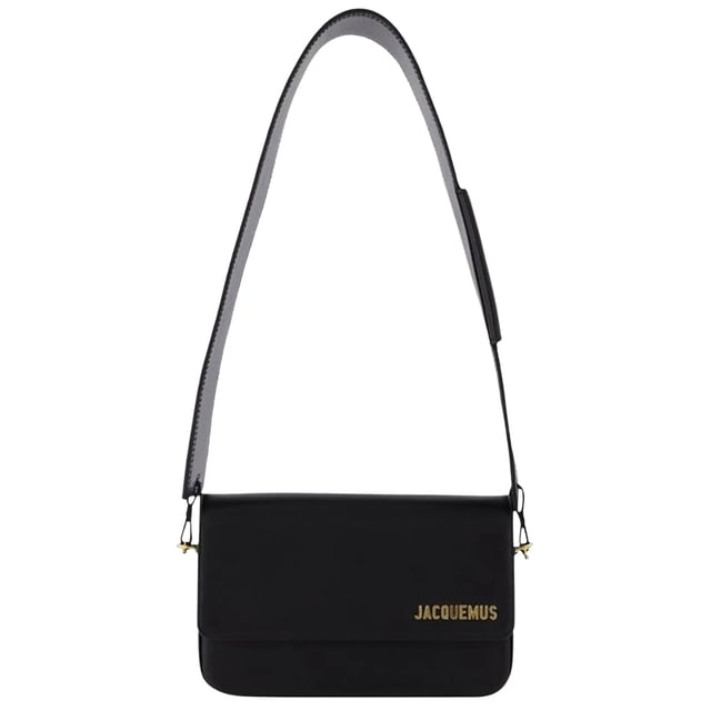 Jacquemus Le Carinu Black Bag is the epitome of contemporary luxury that every fashion-forward woman deserves. This sleek designer accessory combines minimalist French aesthetics with practical functionality. The sophisticated black finish ensures versatility with any outfit, from casual daywear to elegant evening ensembles. Crafted with meticulous attention to detail, this coveted piece instantly elevates your style credentials while offering the perfect size for your essentials. Don't miss the opportunity to own this season's must-have accessory. Dimensions: 12 x 18.5cm. 100% Leather Made In Spain