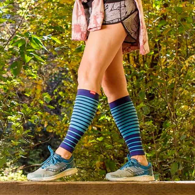 VIM & VIGR Nylon 15-20 mmHg Graduated Compression Sleeves: Revitalize your legs with VIM & VIGR Compression Sleeves. Designed to provide targeted relief, these sleeves use integrally-knit graduated compression to energize your legs. The therapeutic pressure starts at the ankle and gradually eases upward, reducing swelling and alleviating achiness. Whether you're sitting or standing for long periods, these sleeves offer the support you need throughout the day. Crafted from premium nylon fibers and spandex, these sleeves provide 15-20 mmHg compression, making them perfect for all-day wear. Ideal for a variety of activities, including running, cycling, hiking, or simply everyday use, these sleeves help improve circulation and aid in muscle recovery. The moderate compression helps re-energize and support your legs while preventing fatigue. With their flexible toe pocket and contoured fit, these compression sleeves are designed for comfort. Available in four vibrant colors and three sizes, they provide a tailored fit for optimal support. Machine washable for easy care, these sleeves are a trusted solution for anyone with circulation issues or those needing relief after a long day. Extra Product Details: Compression Level: 15-20 mmHg Materials: 91% Nylon, 9% Spandex (Latex-free) Sizes: Small/Medium, Medium/Large, Large/X-Large Colours: Black, Colbalt/Sky, Grass, Orchid Flexible Toe Pocket Machine Washable Ideal for Circulation Problems and Muscle Recovery
