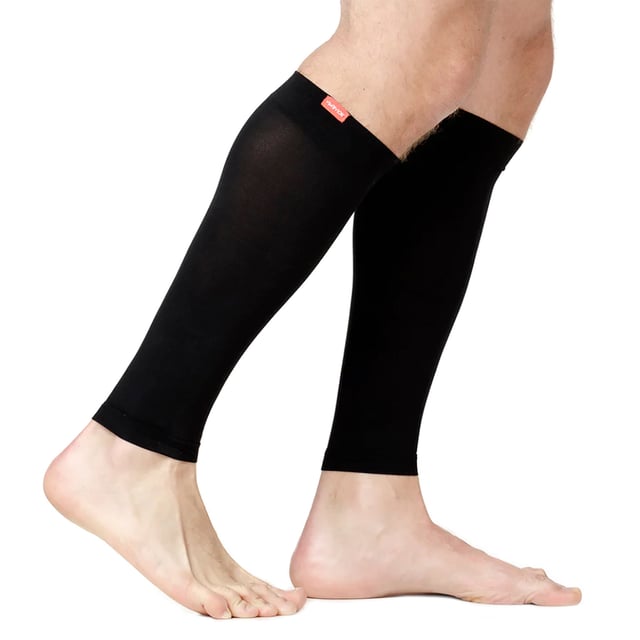 VIM & VIGR Nylon 15-20 mmHg Graduated Compression Sleeves: Revitalize your legs with VIM & VIGR Compression Sleeves. Designed to provide targeted relief, these sleeves use integrally-knit graduated compression to energize your legs. The therapeutic pressure starts at the ankle and gradually eases upward, reducing swelling and alleviating achiness. Whether you're sitting or standing for long periods, these sleeves offer the support you need throughout the day. Crafted from premium nylon fibers and spandex, these sleeves provide 15-20 mmHg compression, making them perfect for all-day wear. Ideal for a variety of activities, including running, cycling, hiking, or simply everyday use, these sleeves help improve circulation and aid in muscle recovery. The moderate compression helps re-energize and support your legs while preventing fatigue. With their flexible toe pocket and contoured fit, these compression sleeves are designed for comfort. Available in four vibrant colors and three sizes, they provide a tailored fit for optimal support. Machine washable for easy care, these sleeves are a trusted solution for anyone with circulation issues or those needing relief after a long day. Extra Product Details: Compression Level: 15-20 mmHg Materials: 91% Nylon, 9% Spandex (Latex-free) Sizes: Small/Medium, Medium/Large, Large/X-Large Colours: Black, Colbalt/Sky, Grass, Orchid Flexible Toe Pocket Machine Washable Ideal for Circulation Problems and Muscle Recovery