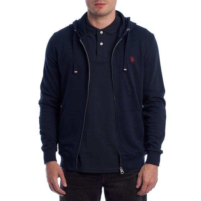 Designed for those who value functionality without sacrificing style, this US Polo Assn. zip-up hoodie combines comfort, contemporary design, and sporting heritage. Ideal for casual looks or light workouts, it adapts to the pace of everyday life with a timeless aesthetic.

 Details:
 - Full zip front closure.
 - Hood with adjustable contrasting drawstring.
 - Round neck.
 - Functional kangaroo pockets.
 - US Polo Assn. logo embroidered on the chest.
 - Soft and stretchy fabric, ideal for everyday use.
 - Ribbed cuffs and waistband.
 - Matching visible seams.

 At US Polo Assn., every garment reflects the authentic spirit of the sport of polo. This men's sweatshirt represents our commitment to quality, comfort, and classic style reinvented for the modern man.
 Composition: 100% Cotton
 Care:
Wash at maximum temperature 30º.
 Iron at low temperature.
 Do not use bleach.
 Do not use a dryer.
 Do not dry clean.