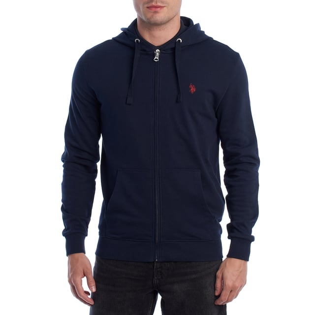 Designed for those who value functionality without sacrificing style, this US Polo Assn. zip-up hoodie combines comfort, contemporary design, and sporting heritage. Ideal for casual looks or light workouts, it adapts to the pace of everyday life with a timeless aesthetic.

 Details:
 - Full zip front closure.
 - Hood with adjustable contrasting drawstring.
 - Round neck.
 - Functional kangaroo pockets.
 - US Polo Assn. logo embroidered on the chest.
 - Soft and stretchy fabric, ideal for everyday use.
 - Ribbed cuffs and waistband.
 - Matching visible seams.

 At US Polo Assn., every garment reflects the authentic spirit of the sport of polo. This men's sweatshirt represents our commitment to quality, comfort, and classic style reinvented for the modern man.
 Composition: 100% Cotton
 Care:
Wash at maximum temperature 30º.
 Iron at low temperature.
 Do not use bleach.
 Do not use a dryer.
 Do not dry clean.