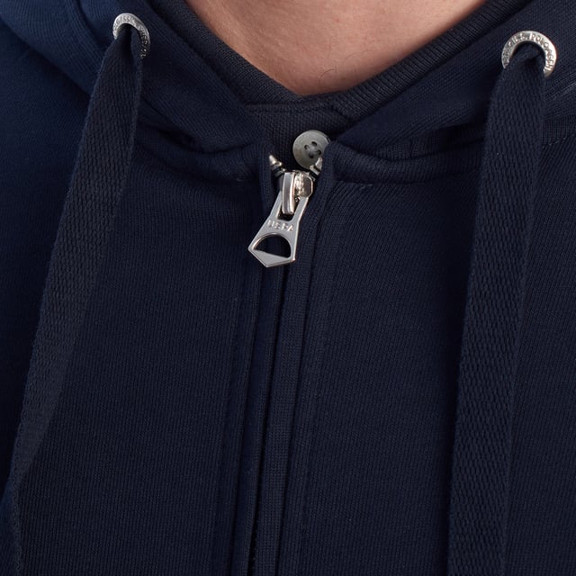 Designed for those who value functionality without sacrificing style, this US Polo Assn. zip-up hoodie combines comfort, contemporary design, and sporting heritage. Ideal for casual looks or light workouts, it adapts to the pace of everyday life with a timeless aesthetic.

 Details:
 - Full zip front closure.
 - Hood with adjustable contrasting drawstring.
 - Round neck.
 - Functional kangaroo pockets.
 - US Polo Assn. logo embroidered on the chest.
 - Soft and stretchy fabric, ideal for everyday use.
 - Ribbed cuffs and waistband.
 - Matching visible seams.

 At US Polo Assn., every garment reflects the authentic spirit of the sport of polo. This men's sweatshirt represents our commitment to quality, comfort, and classic style reinvented for the modern man.
 Composition: 100% Cotton
 Care:
Wash at maximum temperature 30º.
 Iron at low temperature.
 Do not use bleach.
 Do not use a dryer.
 Do not dry clean.