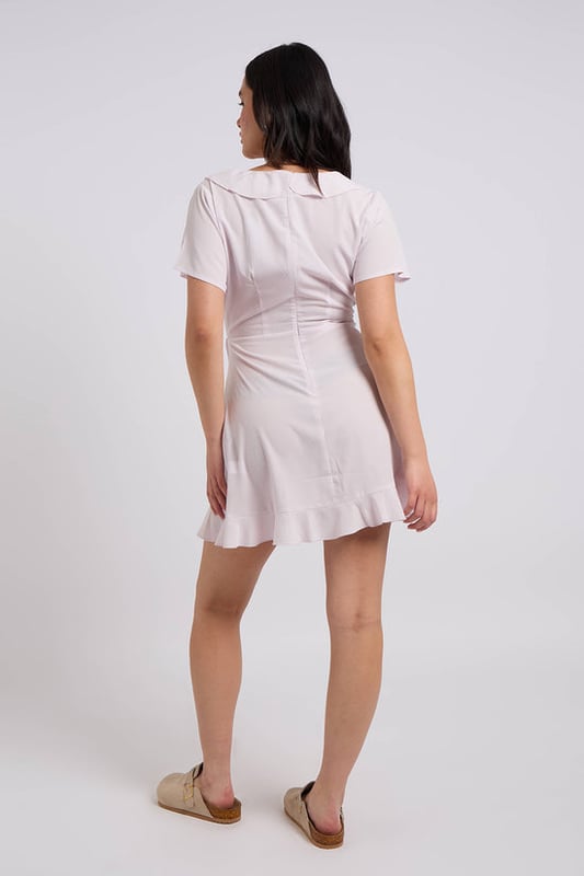 The model is 5'6 and wears a size 8.

Frill Detail
Short Sleeve
Available in different colours



The striking purple hue instantly adds a burst of colour, perfect for sunny days and special occasions. Crafted from a soft, breathable woven fabric, this dress offers both comfort and style. The short sleeves (SS) and frill detailing along the neckline and hemline bring a playful, feminine touch, while the tea-length design creates a flattering, flowy silhouette.