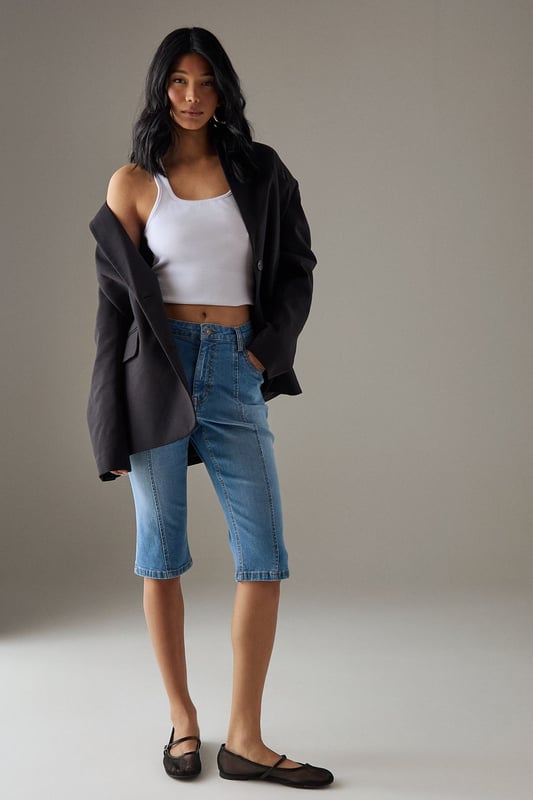 Classic knee-length denim capri with a clean, streamlined silhouette
        High-rise waistband for a flattering fit and comfortable coverage
        Traditional five-pocket styling with visible contrast stitching
        Straight-cut leg design with a neat, finished hem
        Crafted from 100% cotton for breathable comfort and durability
    
    These versatile denim capris from Warehouse strike the perfect balance between casual comfort and refined style. The high-rise design creates a sleek silhouette that pairs beautifully with both fitted and oversized tops. Style them with a crisp white crop top and an oversized leather jacket for an effortlessly cool daytime look, or dress them up with a silky blouse and pointed heels for evening drinks. The straight-cut leg offers a timeless appeal that works wonderfully for family gatherings or weekend brunches. These capris transition seamlessly between seasons - wear them with trainers and a light jumper for cooler days or with sandals and a floaty top when temperatures rise. Their durable cotton construction ensures they'll remain a wardrobe staple for years to come.