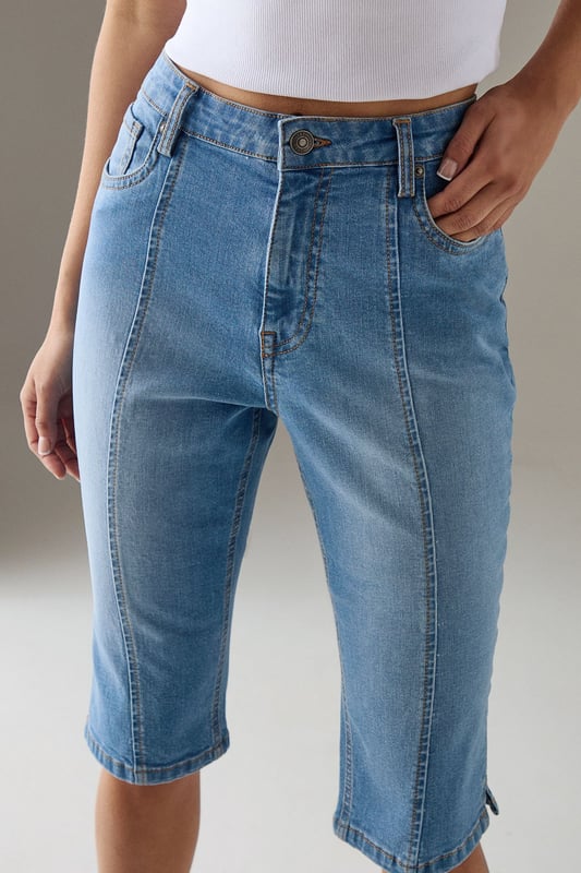 Classic knee-length denim capri with a clean, streamlined silhouette
        High-rise waistband for a flattering fit and comfortable coverage
        Traditional five-pocket styling with visible contrast stitching
        Straight-cut leg design with a neat, finished hem
        Crafted from 100% cotton for breathable comfort and durability
    
    These versatile denim capris from Warehouse strike the perfect balance between casual comfort and refined style. The high-rise design creates a sleek silhouette that pairs beautifully with both fitted and oversized tops. Style them with a crisp white crop top and an oversized leather jacket for an effortlessly cool daytime look, or dress them up with a silky blouse and pointed heels for evening drinks. The straight-cut leg offers a timeless appeal that works wonderfully for family gatherings or weekend brunches. These capris transition seamlessly between seasons - wear them with trainers and a light jumper for cooler days or with sandals and a floaty top when temperatures rise. Their durable cotton construction ensures they'll remain a wardrobe staple for years to come.